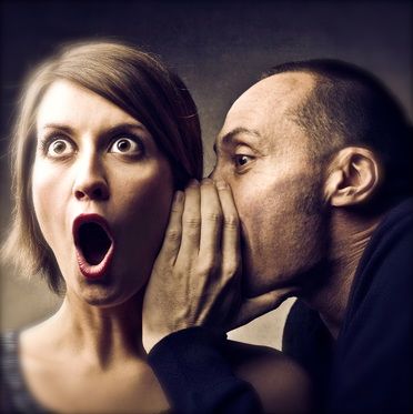 About_Roles and Goals_photo of man whispering secrets into a shocked woman's ear