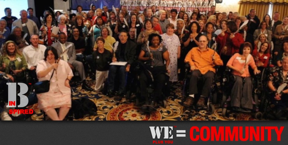 Be Inspired_Story Flag Exhibit_We Plus You Equals Community_photo of 200 disability advocates in front of Story Flag exhibit