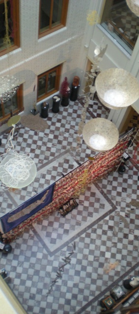 Be Involved_Story Flag Exhibit_photo form above looking down at story flag in the Portland City Hall for a Disability History Month installation.